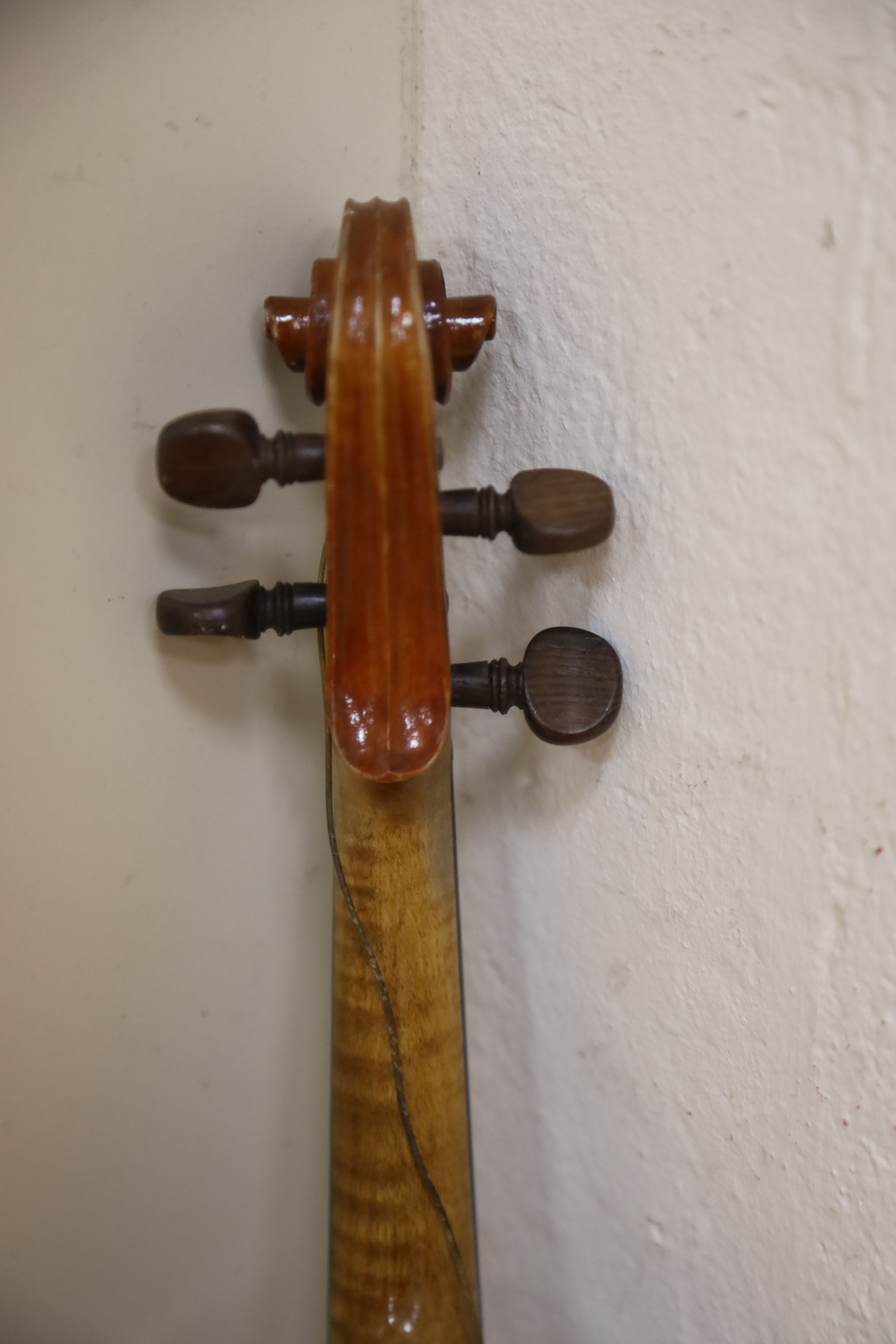 A Stradivarius copy violin and two bows and another bow, both cased, backs 33cm and 30cm